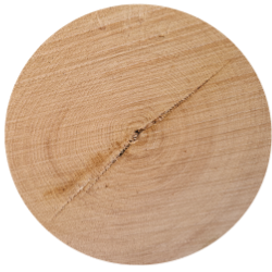A circular piece of wood with a hole in it.